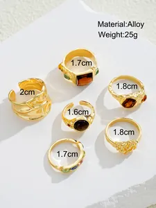 Detailed set of six vintage alloy rings with amber gems and lava stone textures