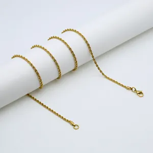 Detailed close-up of a golden rope chain wrapped on a stand with a lobster clasp