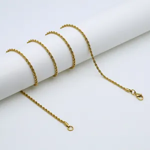 Detail shot of golden twisted rope chain featuring high-shine finish and lobster clasp