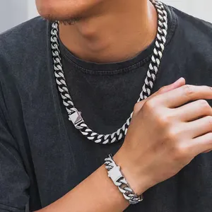 Detailed view of silver stainless steel Cuban link necklace with industrial square buckle