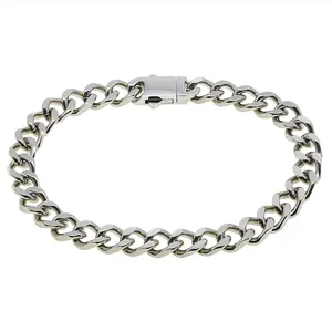 Detailed macro view of the silver stainless steel Cuban link bracelet and secure clasp