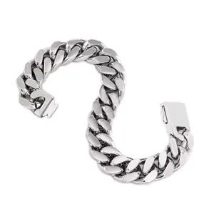 Macro shot of silver stainless steel Cuban link bracelet with a sleek box clasp closure