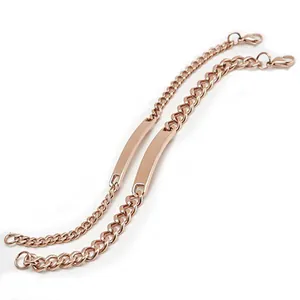Detail of rose gold couples cuban link bracelets with polished rectangle ID plates