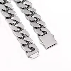 Close-up of polished silver stainless steel Cuban link necklace with rectangular buckle