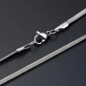 Detailed close-up of a silver stainless steel snake bone chain with a lobster clasp