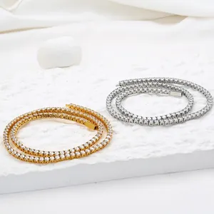 Close-up of gold and silver tennis chains with 3mm-5mm cubic zirconia stones in prong setting