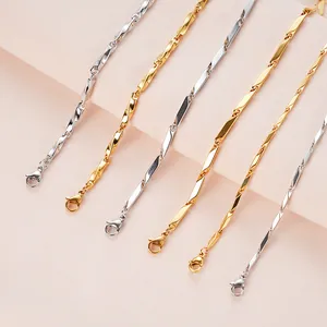 Close-up of gold and silver twisted cuban chains with secure lobster claw clasps