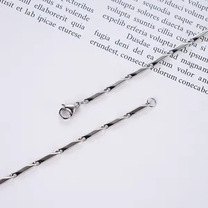 Macro shot of silver twisted cylinder link necklace with a secure lobster clasp