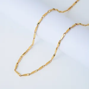 Macro shot of gold-plated stainless steel cylindrical link chain with a glossy finish