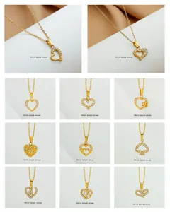 Collection of 11 golden necklaces with heart pendants and micro-inlaid zircon details