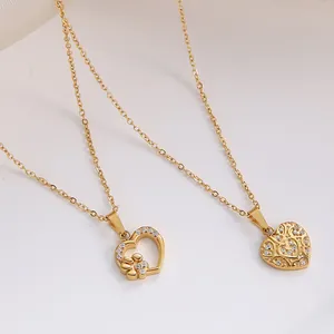 Detail of 18K gold heart necklaces with hollow pet paw design and zircon stones