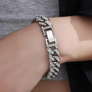 Detailed view of silver 316L stainless steel Cuban bracelet with pave set cubic zirconia stones