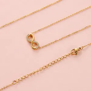 Collar con colgante de infinito en acero inoxidable dorado y circonitas engastadas a mano