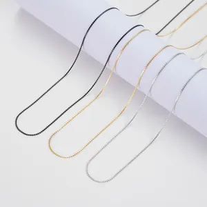 Close-up of 304 stainless steel flat S-chain necklaces in black, gold, and silver finishes