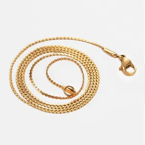 Close-up of golden stainless steel S-shaped chain with a secure lobster clasp closure