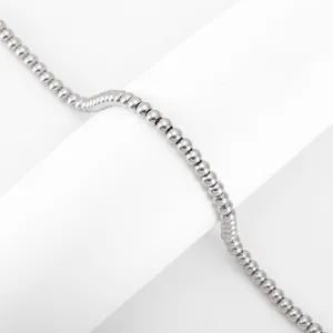 Macro detail of 4mm polished stainless steel bead chain with reflective metallic finish