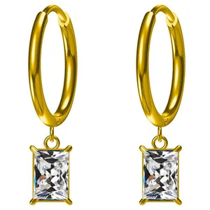 Macro view of 18K gold plated hoop earrings featuring emerald cut rectangular zircons