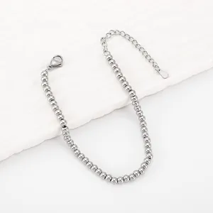 Minimalist 4mm silver beaded bracelet in polished stainless steel with lobster clasp