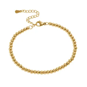 Detail of 4mm gold beaded stainless steel bracelet with lobster clasp and extender