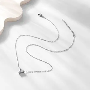 Elegant silver 18K gold triangle necklace with clear zircon pendant on a white background