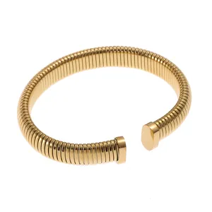 Bracciale elastico a molla in oro acciaio al titanio con estremità ovali in stile sobrio