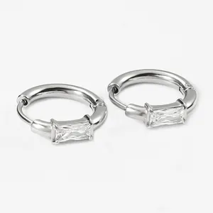 Detail of silver hoop earrings with rectangular step-cut zircon inlay and snap closure