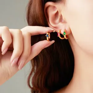 Elegant gold titanium steel earrings set with oval sapphire, ruby and emerald zircons