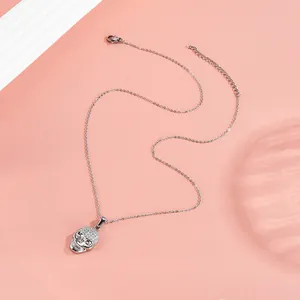 Detail of silver skull pendant with micro-paved zircons and adjustable lobster clasp