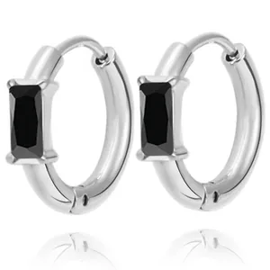 Close-up of silver-tone hoop earrings with rectangular black cubic zirconia settings