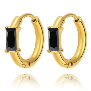Detail of gold hoop earrings with emerald-cut black zircon stone and polished finish