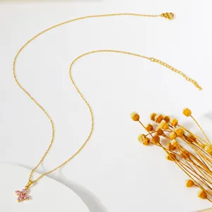 Golden stainless steel four-leaf clover necklace with sparkling pink zircon pendant