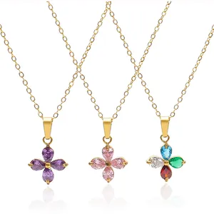 Detail view of four-leaf clover necklaces with colorful zircon stones in gold plating