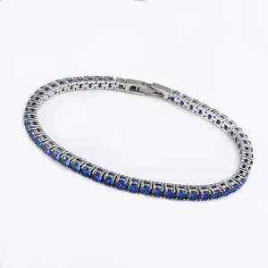 Macro detail of 3mm blue zircon tennis bracelet with S.STEEL hallmark engraving