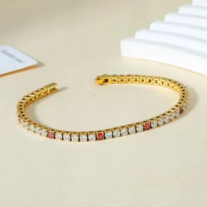 Detail of 3mm gold-plated tennis bracelet with red and white cubic zirconia stones