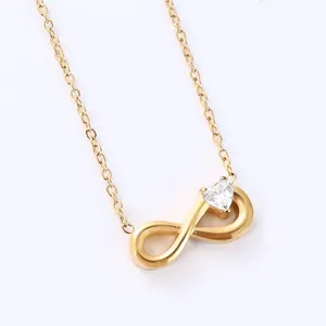 Gold infinity pendant necklace with a heart-shaped zircon inlay on a delicate link chain