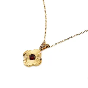 Titanium steel gold necklace with four-leaf clover pendant and red zircon center