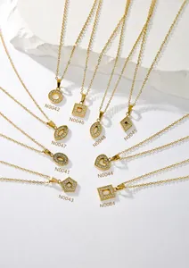 Collection of gold geometric pendant necklaces featuring sparkling cubic zirconia stones