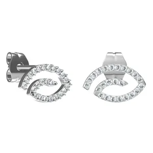 Macro detail of silver titanium steel earrings with pavé set white zircon stones
