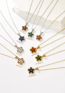 Close-up of Petal Series floral pendants with colorful zircon crystals in gold and silver