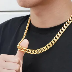 Close-up of a chunky golden stainless steel Cuban link necklace on a male model neck