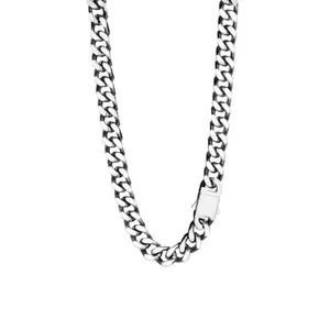 Detailed view of heavy silver curb chain with secure square clasp on white background