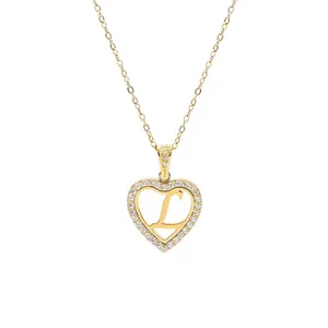 Elegant gold titanium heart necklace featuring a crystal-set letter L pendant