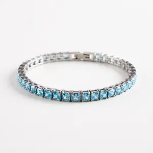 Detail of square light blue zirconia tennis bracelet with silver metal clasp