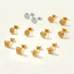 Macro shot of geometric stud earrings with heart and star shapes in pavé crystal finish