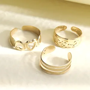 Three-piece gold hollow heart and layered open rings set for beach and joint wear