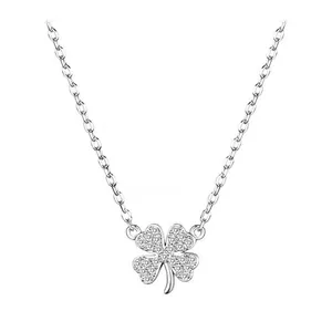 Macro shot of silver clover pendant with shimmering pave-set cubic zirconia crystals