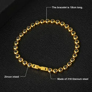 Macro detail of 18cm gold titanium bracelet with black zircon inlays and fold-over clasp