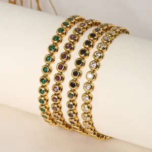 Detailed macro view of colorful round zircon tennis bracelets on a white leather stand