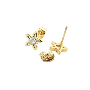 Golden five-petal flower stud earrings with central zircon stone on white background