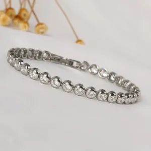 Macro detail of silver tennis bracelet featuring round cubic zirconia in bezel setting